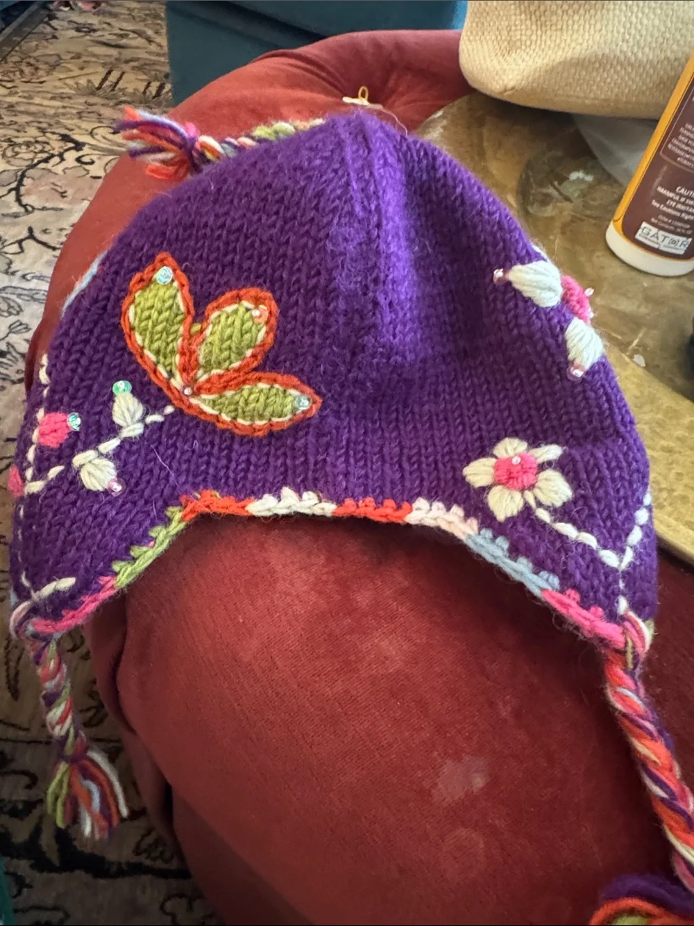 Everest Designs Purple Floral Knit Earflap Hat for Kids with Braided Tassels